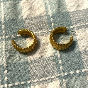 Gold toned half hoop ridged earrings
